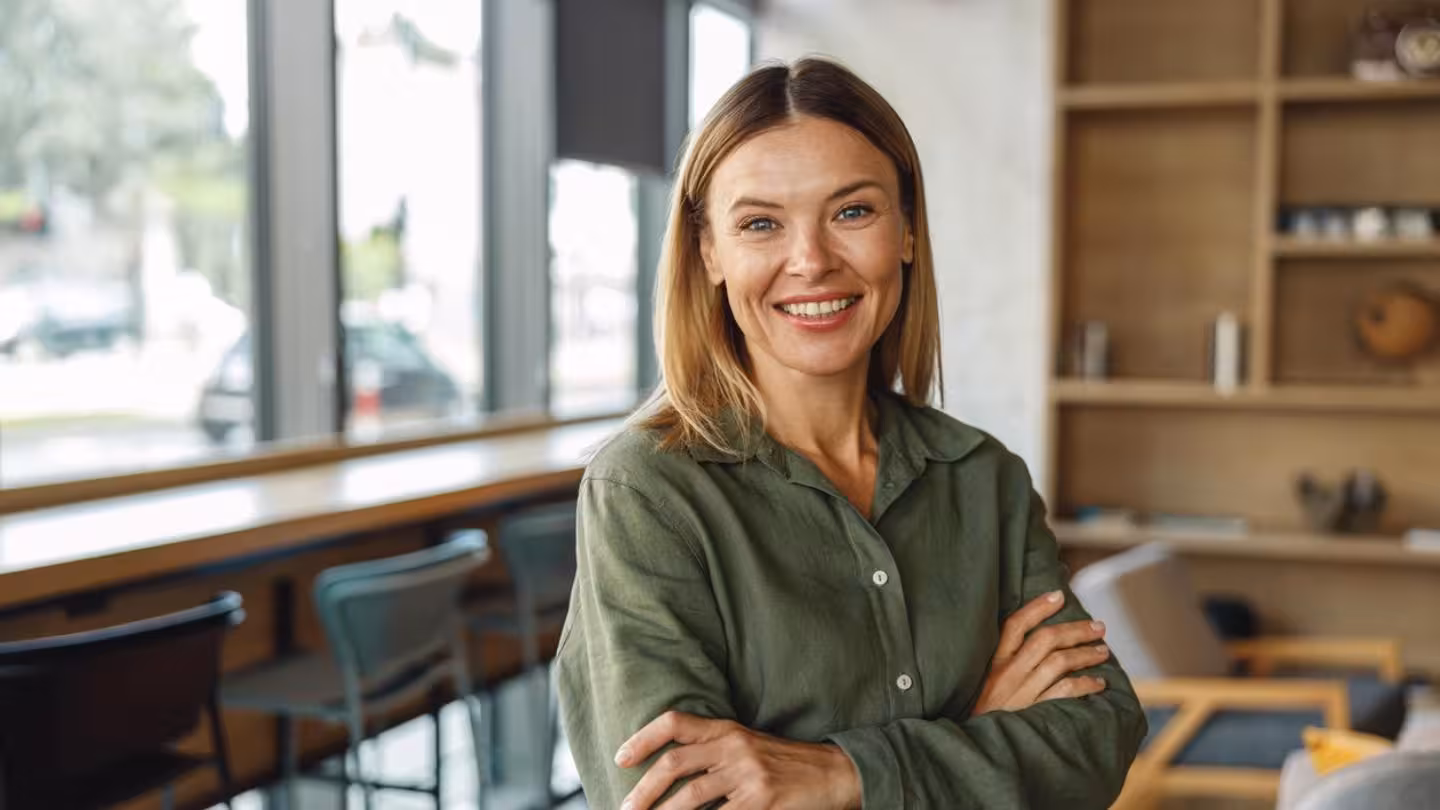 Lady Smiling In Her Own Shop 1440X810